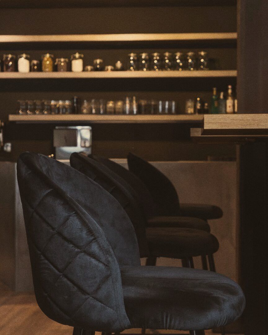 Stools in front of the bar at Stillroom