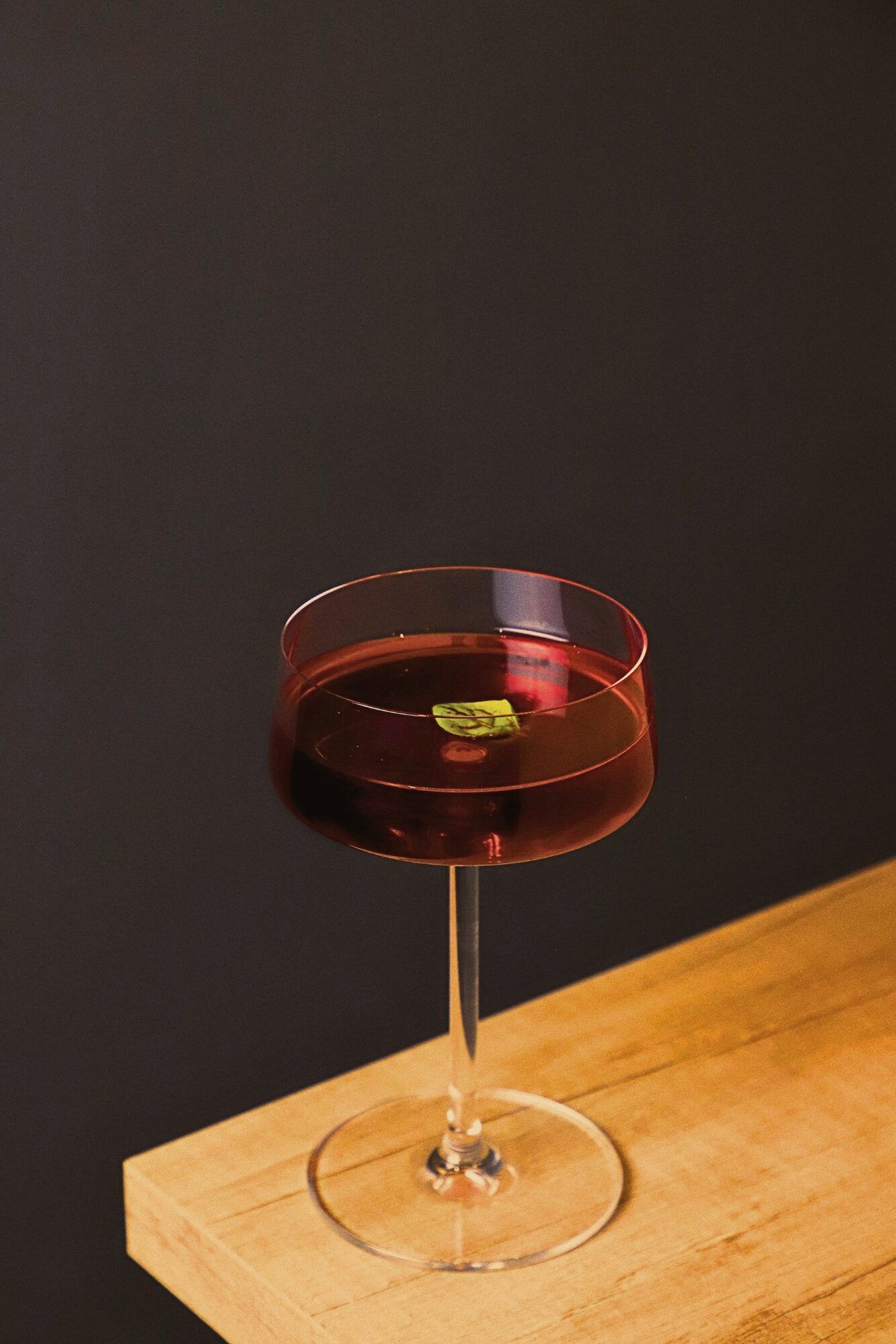 A glass on the bar at night